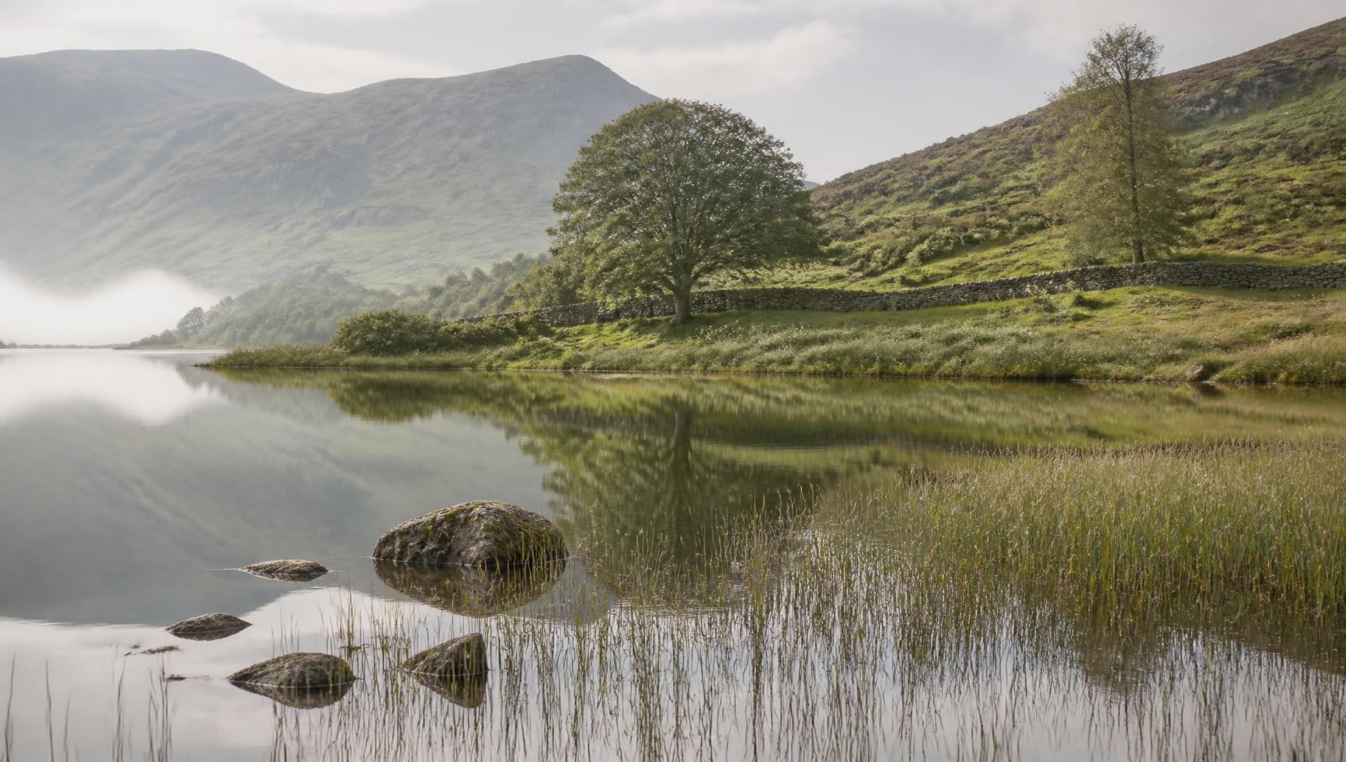 Still water and fells near Far Sawrey on a misty morning