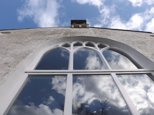 One of the tall arched windows inside the Braithwaite Hall